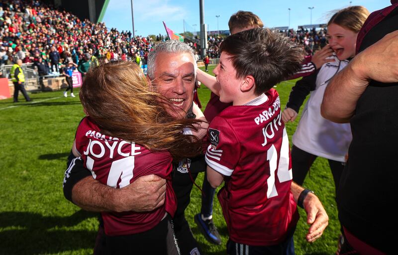 Galway manager Pádraic Joyce celebrates with his daughter Jodie and son Charlie in Castlebar. Photograph: Ryan Byrne/Inpho