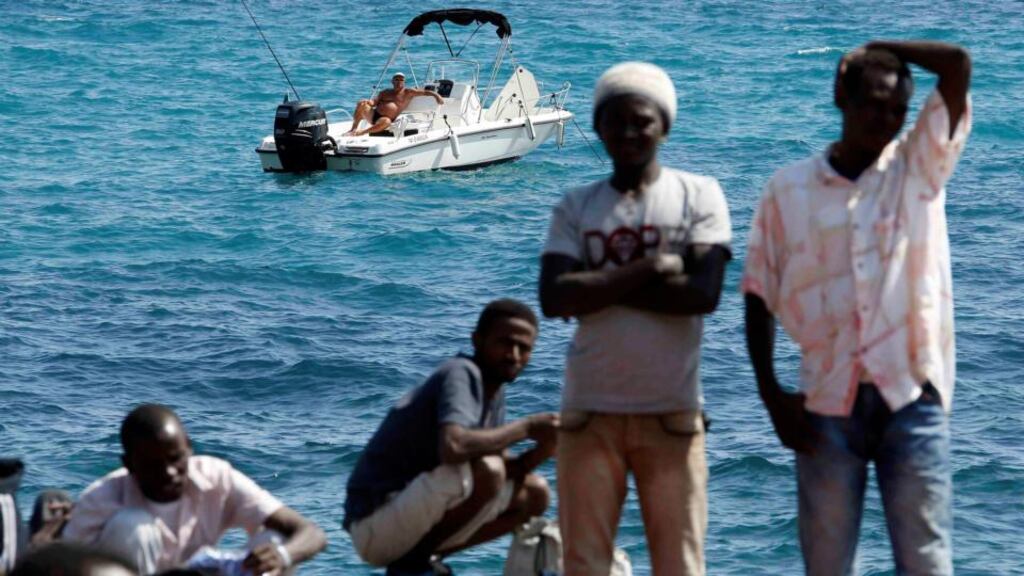 Migrants gather at a border crossing on the Mediterranean between Italy and France: the EU is focused on increasing the budget for Frontex, the EU agency for the management of co-operation at external borders of the union. Photographs: Reuters/Eric Gaillard