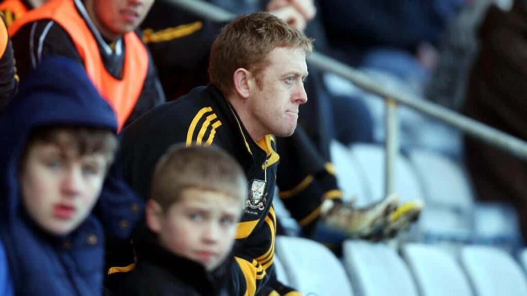 Dr Crokes and Kerry star Colm Cooper looks on in the closing stages after leaving the field injured during the All-Ireland club championship semi-final against Castlebar Mitchels, at O’Moore Park, Portlaoise. Photograph: Donall Farmer/Inpho.