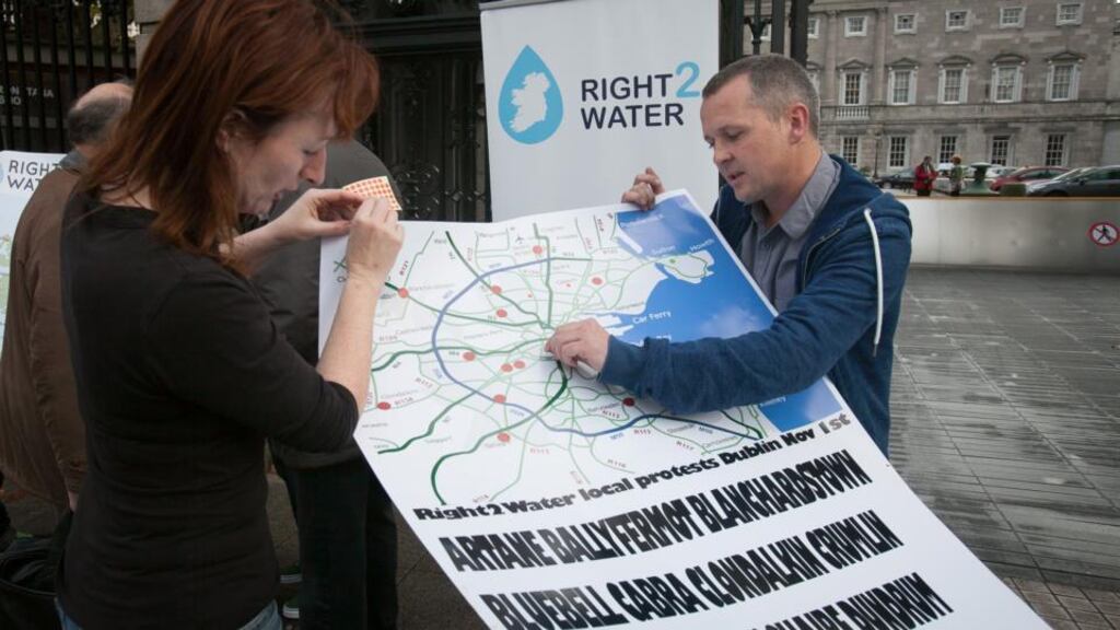 Independent TD Clare Daly, People Before Profit Alliance TD Richard Boyd Barrett at Leinster House, Dublin displaying a large map to highlight all the locations nationwide where Right2water protests will be taking place. Photograph: Gareth Chaney Collins