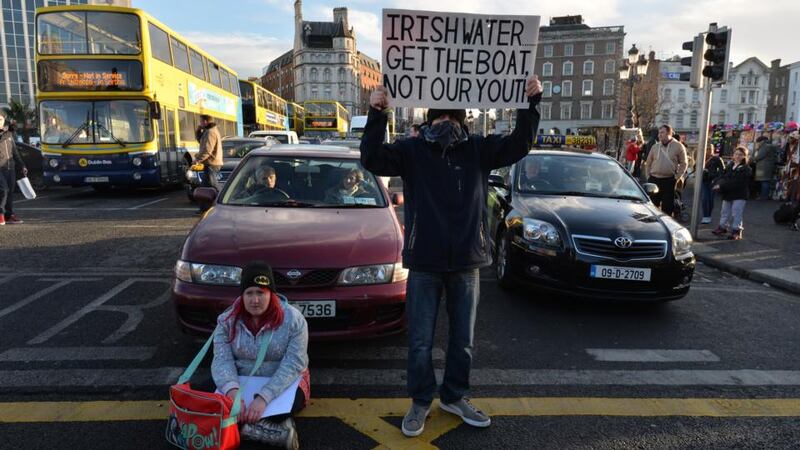 An anti-water charge protesters on O’Connell Bridge in Dublin. Photograph: Alan Betson / The Irish Times.