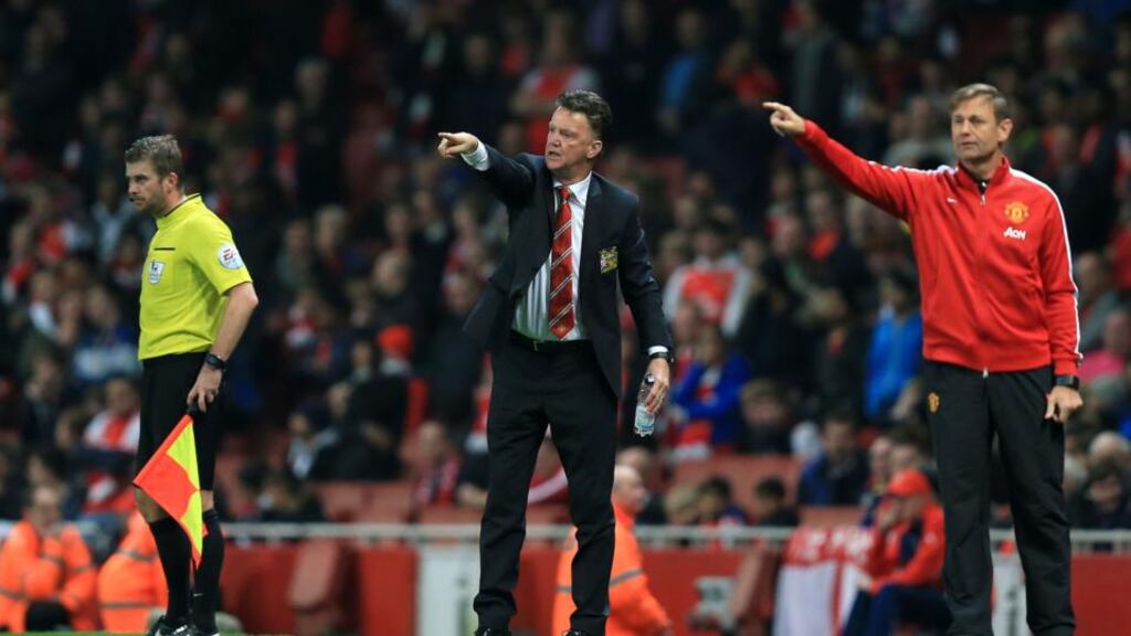 Manchester United manager Louis van Gaal (centre) at the Emirates Stadium. “ Van Gaal’s new style looked more like Italian football – let the others play, then kill them on the counter.” Photo: Mike Egerton/PA
