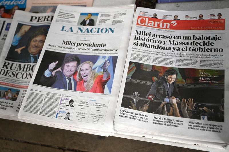 Front pages show the victory of Javier Milei in the presidential election run-off. Photograph: Luis Robayo/ AFP via Getty Images