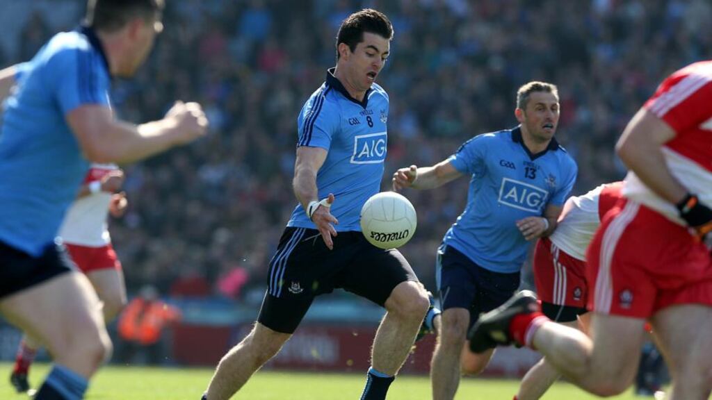 Dublin’s Michael Darragh Macauley in action in during the National League final against Derry. The midfielder will face an intriguing battle against Laois’s John O’Loughllin. Photo: Donall Farmer/Inpho