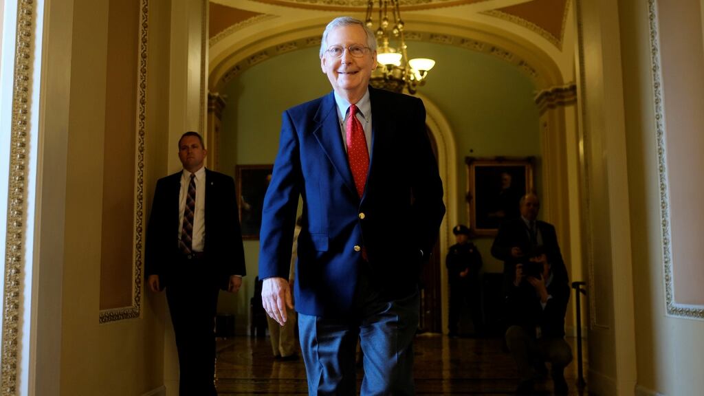US Senate majority leader Mitch McConnell  leaves the Senate floor during debate over the Republican tax reform plan. Photograph: Reuters