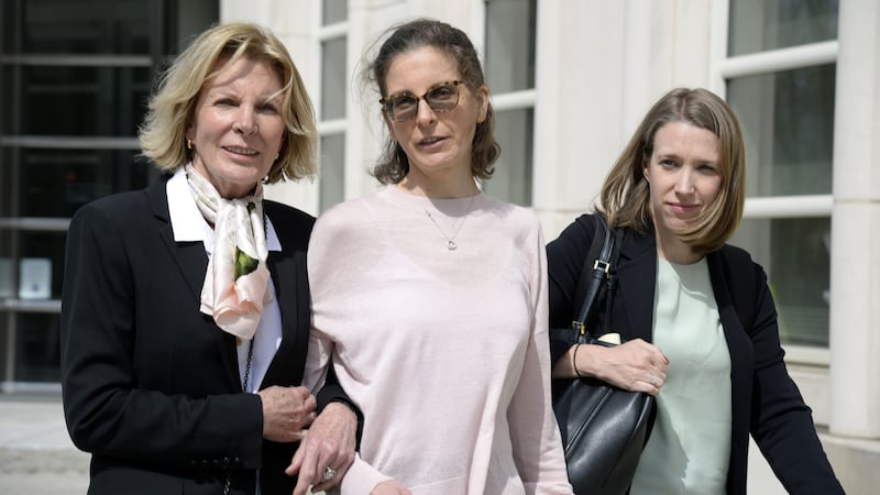 Clare Bronfman (centre), an heiress to the Seagram’s liquor fortune, arrives at a Brooklyn court on Monday.  Bronfman is one of the defendants in the sex-cult case.  Photograph: Jefferson Siegel/The New York Times