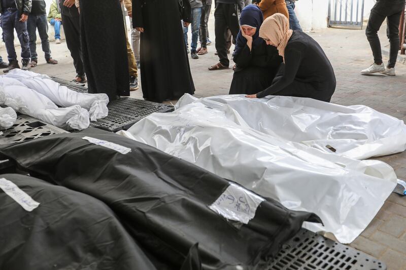 People mourn the victims of an Israeli strike on Rafah. Photograph: Ahmad Hasaballah/Getty