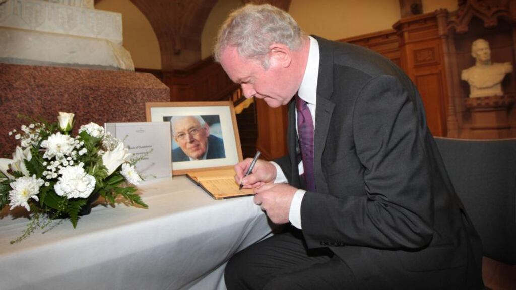 Northern Ireland Deputy First Minister Martin McGuinness signs the book of condolence for Ian Paisley at Derry’s Guildhall. Photograph: Margaret McLaughlin