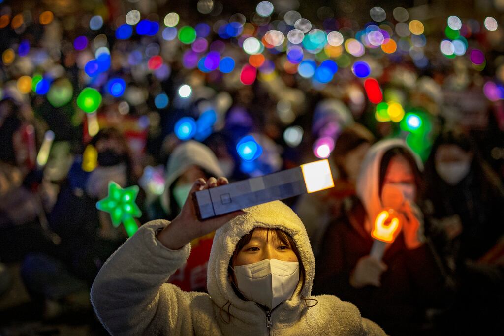 Protesters outside the National Assembly in Seoul on Sunday: There is public suspicion South Korean president Yoon Suk Yeol may try to ride out the crisis sparked by his triggering of martial law last week. Photograph: Ezra Acayan/Getty Images