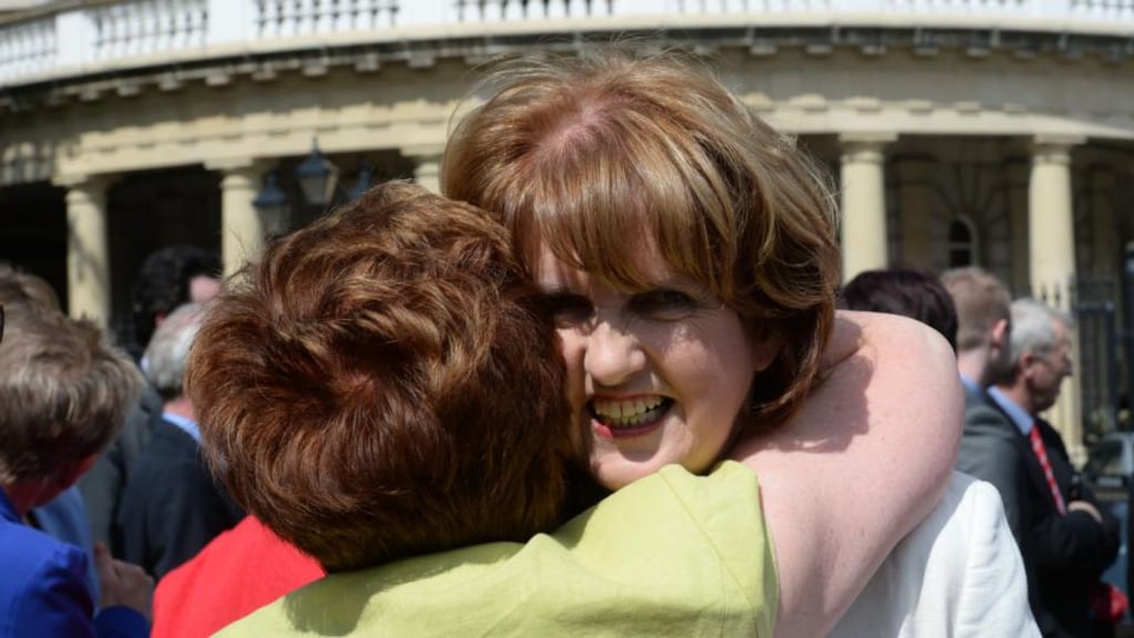 Minister for Social Protection, Joan Burton TD gets a hug from Cllr Mary McCamley, after announcing her bid for leadership of the Labour Party. Photograph; Dara Mac Dónaill