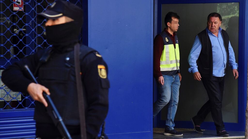 Huesca’s president Agustin Lasaosa (right) is escorted by a policeman after being arrested by Spanish National Police as part of an investigation of an alleged match fixing network in Spanish La Liga and La Liga 2. Photograph: Javier Blasco/EPA