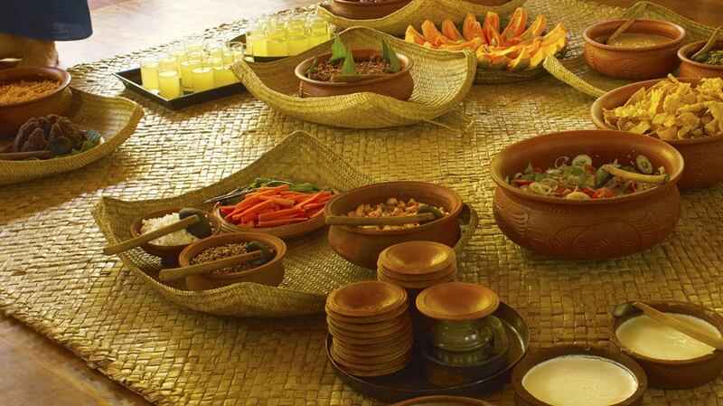 Bowls of locally grown, organic, freshly made salads, dahls and curries are put out for guests to help themselves for dinner.