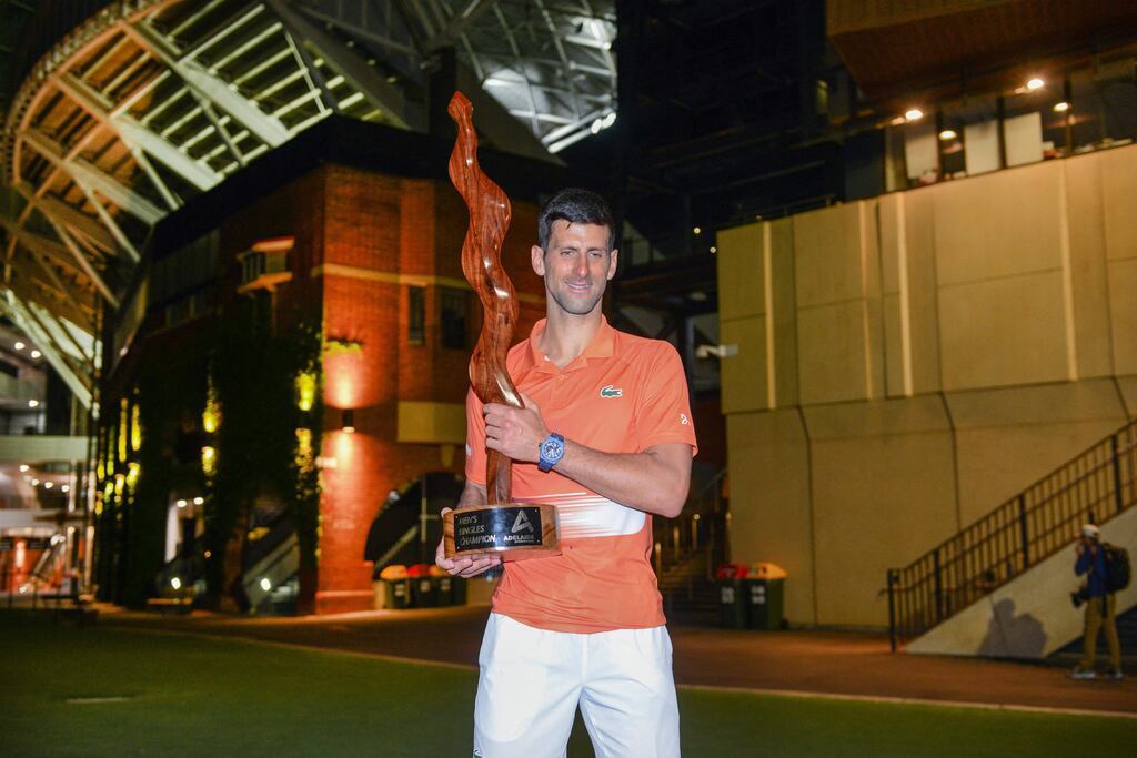 Novak Djokovic poses with the winners trophy after the final of the ATP Adelaide International. Photograph: Brenton Edwards/AFP via Getty Images