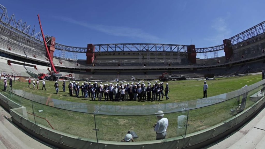 Representatives of Fifa and the local organising committee visiting the Arena da Baixada Stadium in March 2012. Photograph: Heuler Andrey/LatinContent/Getty Images