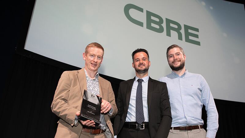 Rafael Bernardes, Awards Judge, presents the Health & Safety Team of the Year to Brian Fitzgerald and Conor Mullins, CBRE GWS Ireland.