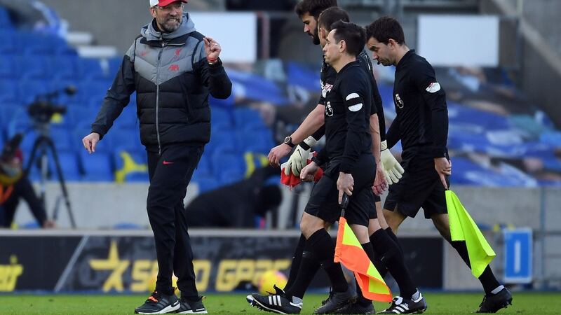 Jurgen Klopp speaks to the officials after his team’s draw at Brighton. Photograph: Getty Images