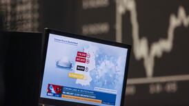 Global stocks waver as investors assess latest Covid restrictions