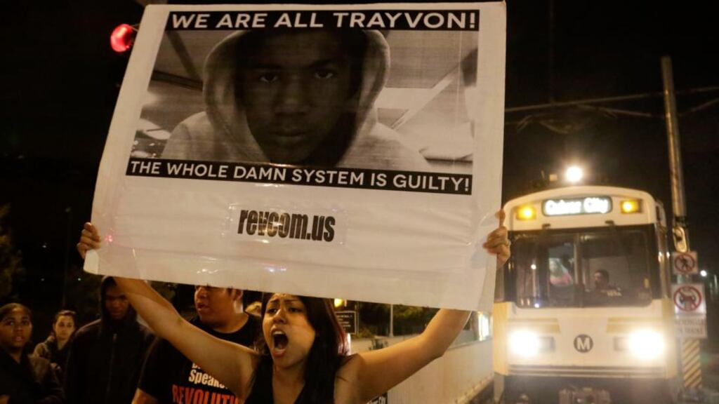 A protester blocks an Expo Line train following the George Zimmerman verdict in Los Angeles, California. Photograph: Jason Redmond/Reuters.