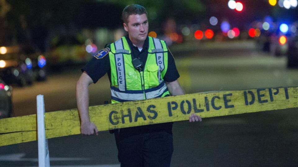 A Police officer closes-off Calhoun Street near the Emanuel African Methodist Episcopal (AME) Church. Photograph: Richard Ellis/ EPA