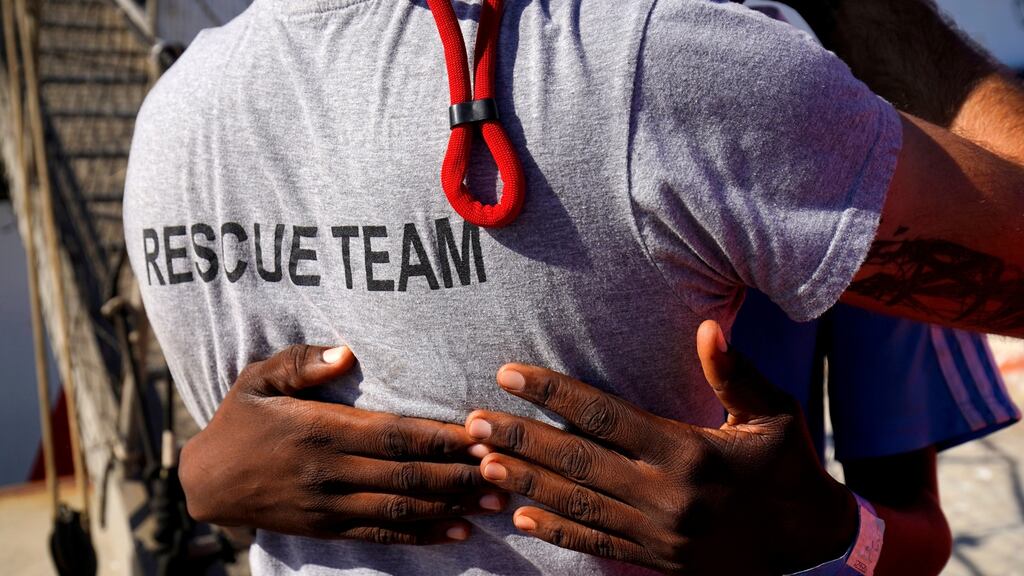 A migrant rescued by NGO vessel Open Arms in the central Mediterranean Sea embraces Open Arms head of mission Riccardo Gatti after arriving at Algeciras in San Roque, southern Spain. Photograph: Reuters