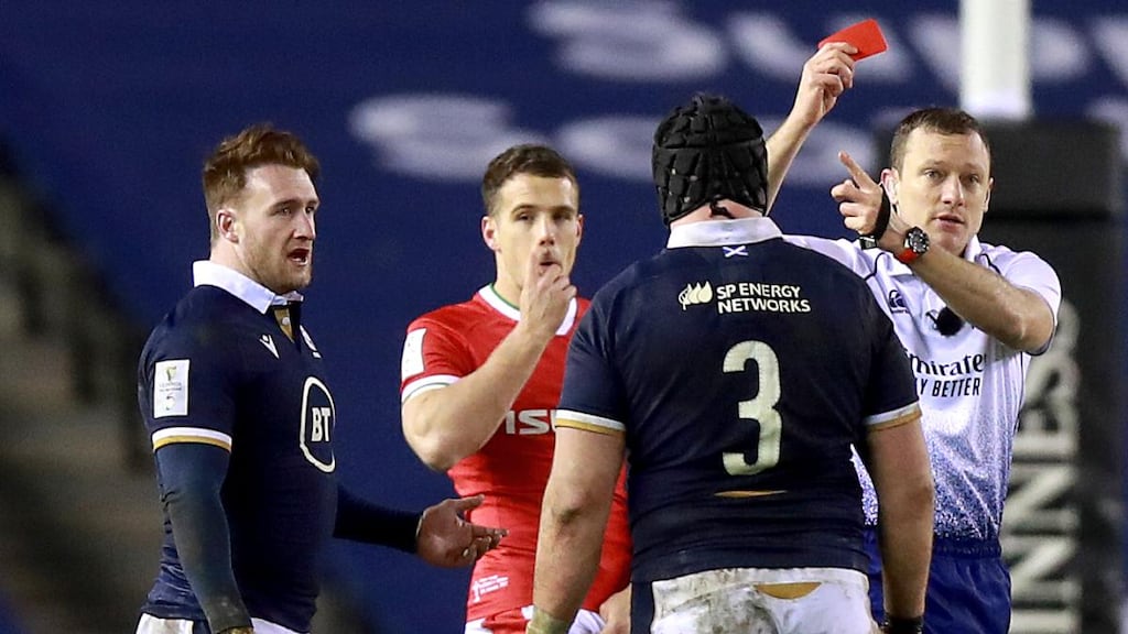 Scotland’s Zander Fagerson is shown a red card by referee Matthew Carley. Photograph: Tommy Dickson/Inpho