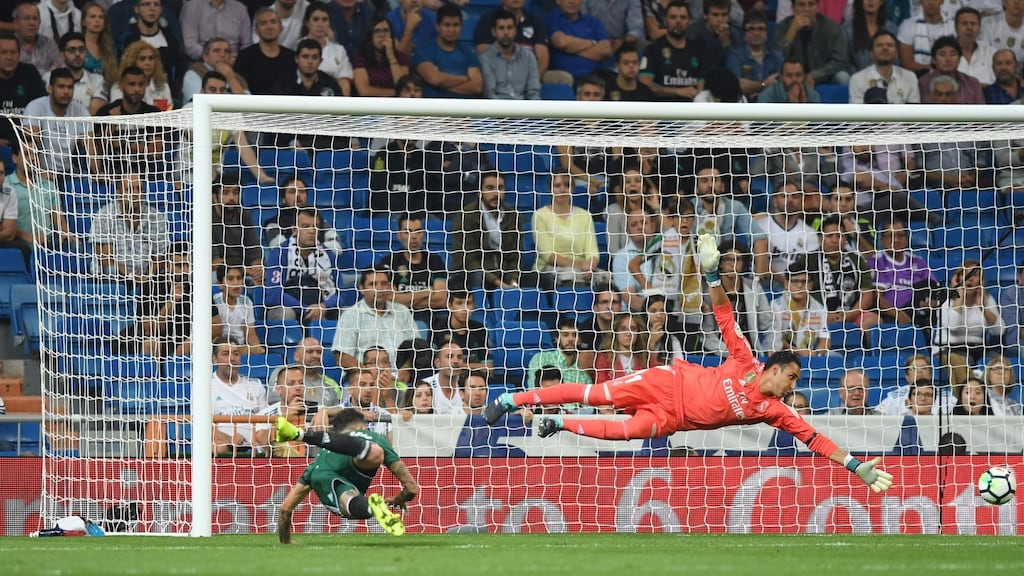 Real Betis striker Arnaldo Sanabria heads home a late winner past Real Madrid goalkeeper Keylor Navas during the La Liga game at the Santiago Bernabeu stadium. Photograph: Gabriel Bouys/AFP/Getty Images
