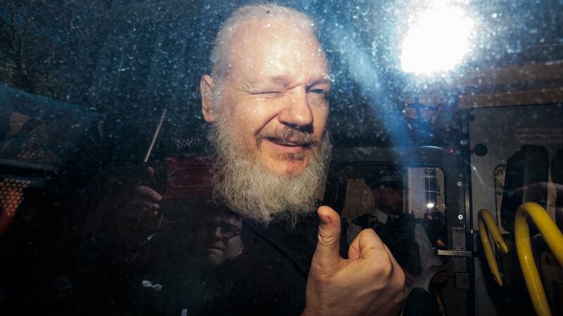 Julian Assange gestures to the media from a police vehicle on his arrival at Westminster Magistrates court on April 11th, 2019 in London, England. Photograph: Jack Taylor/Getty Images