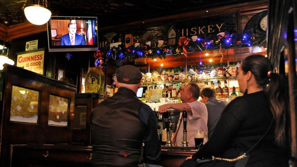Staff and customers watch Taoiseach Enda Kenny’s State of the Nation speech on television in a Dublin pub. Photograph: Dave Meehan