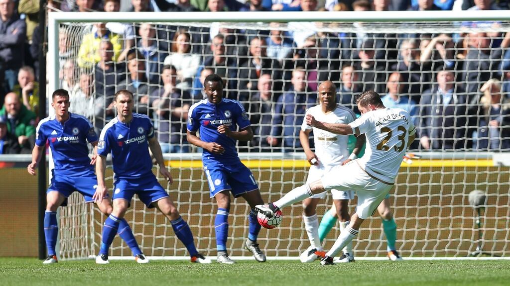 Swansea’s Gylfi Sigurdsson scores the winnign goal Photograph: Reuters/Matthew Childs