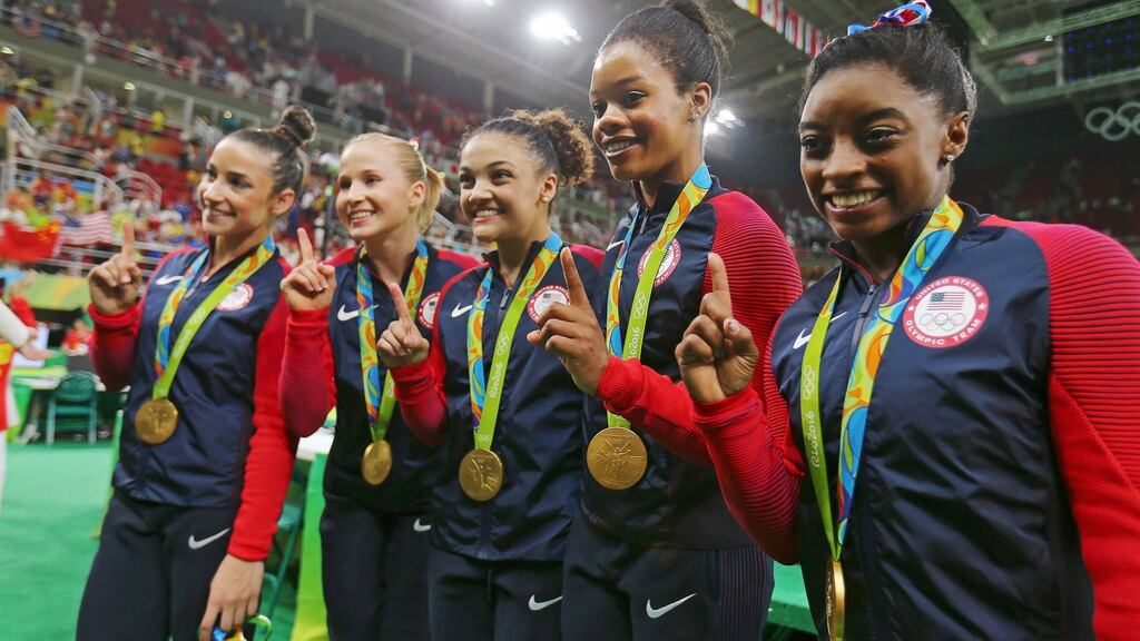 Simone Biles (R) inspired the USA to gold in the artistic team gymnastics. Photograph: Reuters