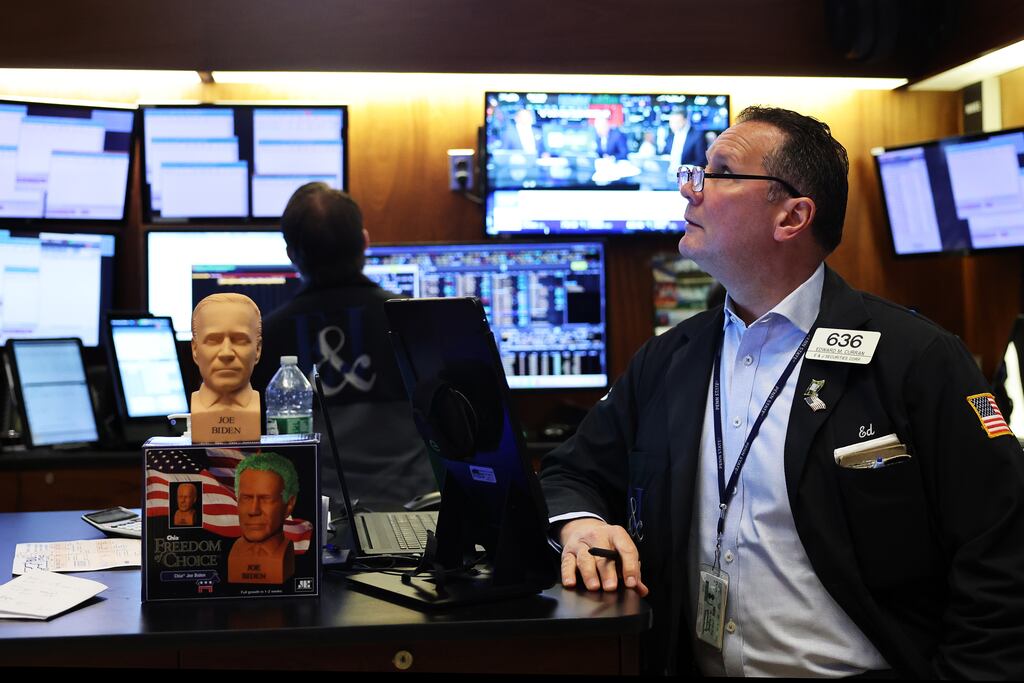 Traders working on the floor of the New York Stock Exchange during morning trading. The S&P 500 and the Dow indexes slipped as investors weighed hawkish Federal Reserve projections against data signalling cooling inflation. Photograph: Getty