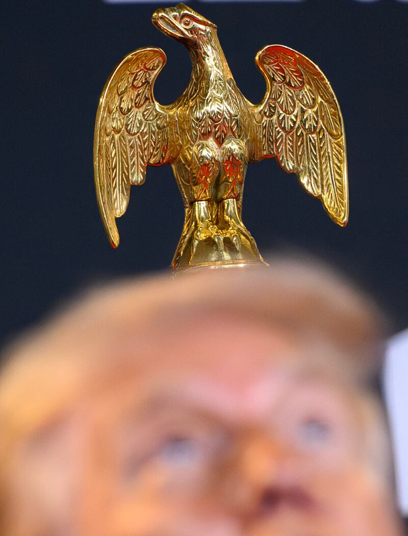 A gold finial of an eagle is seen behind Donald Trump as he speaks at the Kennedy Center. Photograph: Mandel Ngan/AFP