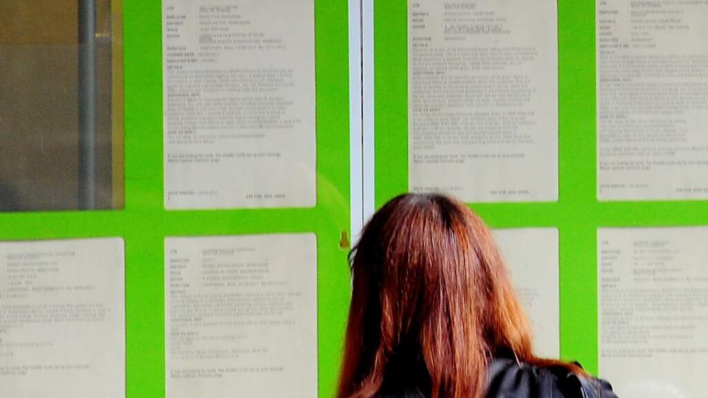 A woman look at information boards in the window of the Job Centre Plus in Derbyshire. Figures released today show the EU unemployment rate was 11 per cent in July and 12.1 per cent in the eurozone. Photograph: PA Wire.