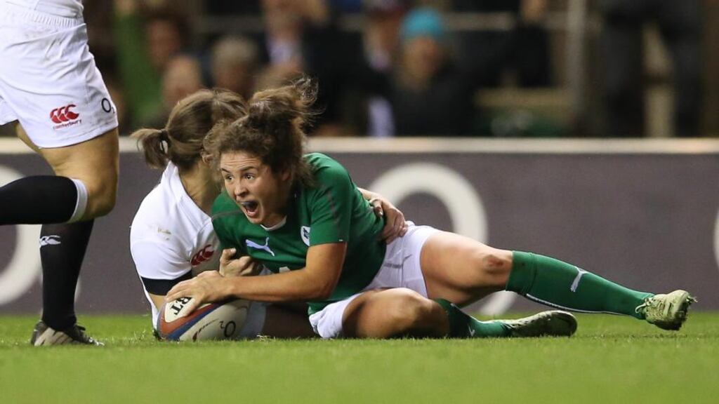 Larissa Muldoon celebrates scoring a try for Ireland during their Six Nations clash with England in Twickenham, on February 22nd, 2014. Ireland lost 17-10. Photograph: James Crombie/Inpho
