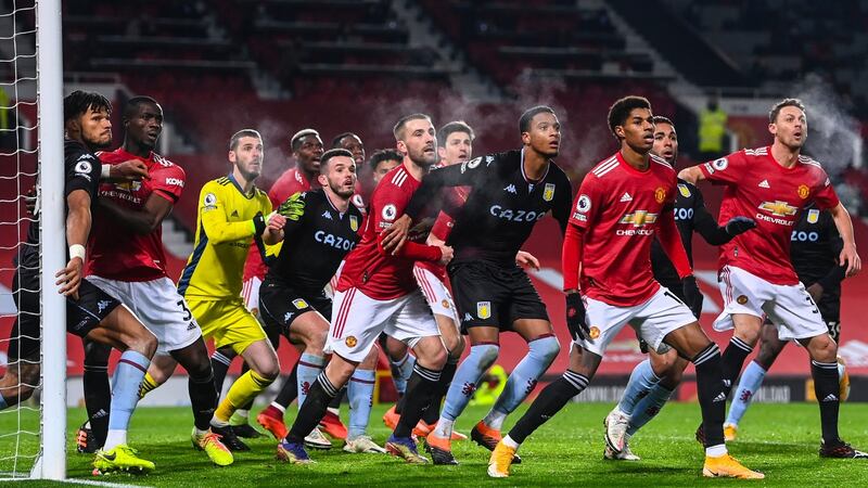 Aston Villa players crowd Manchester United’s box. Photograph: Laurence Griffiths/EPA