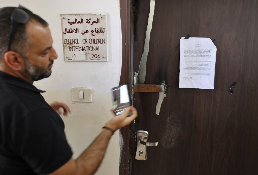The sealed door of Palestinian NGO Defence for Children International after it was raided by Israeli forces in the West Bank city of Ramallah on Thursday. Photograph: Abbas Momani/AFP via Getty Images