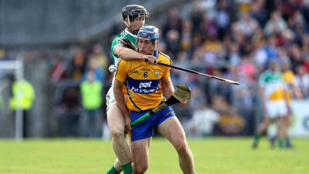 Clare’s Conor Ryan is tackled by Offaly’s Dan Currams during his side’s emphatic Round 1 qualifier win. Photograph: Inpho