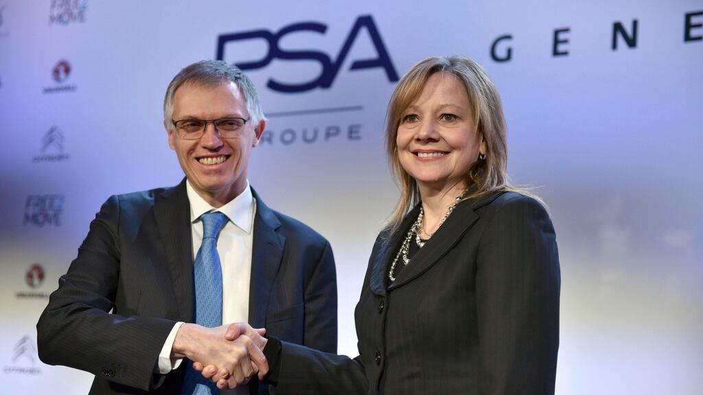 General Motors chief executive Mary Barra  with PSA chief executive Carlos Tavares, after successfully offloaded GM’s  European car business, including Opel and Vauxhall, to the French maker of Peugeot and Citroën. Photograph: AP Photo / Zacharie Scheurer