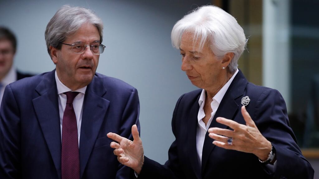 European commissioner for economy Paolo Gentiloni and ECB president Christine Lagarde speak at the start of the Eurogroup finance ministers meeting in Brussels on Monday. Photograph: Olivier Hoslet/EPA