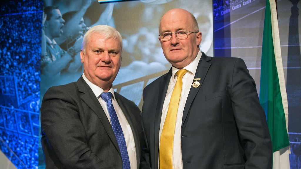 Ex-president of the Gaelic Athletic Association Aogan Ó Fearghail hands over his president’s medal to incoming president John Horan. Photograph: Oisin Keniry/Inpho