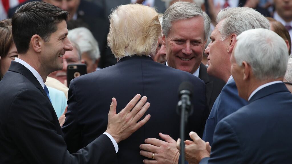 American president Donald Trump gets a pat on the back from senior Republicans. Photograph: Carlos Barria/Reuters