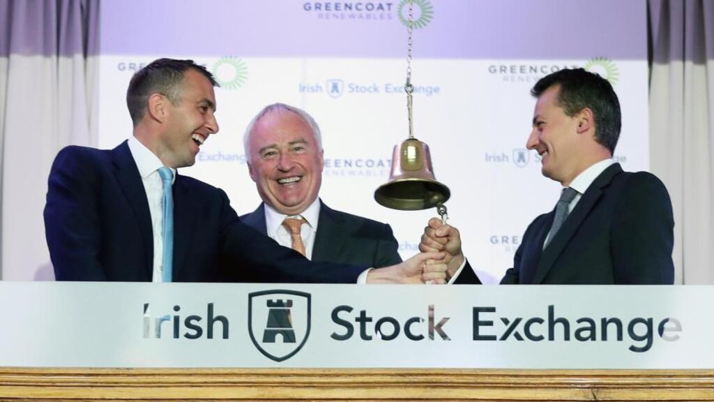 Bertand Gautier and Paul O’Donnell, partners of Greencoat Capital with Rónán Murphy, chairman of Greencoat Renewables Plc at the Irish Stock Exchange. Photograph: Robbie Reynolds