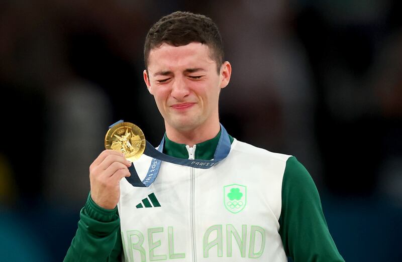 Rhys McClenaghan celebrates after receiving his gold medal. Photograph: James Crombie/Inpho