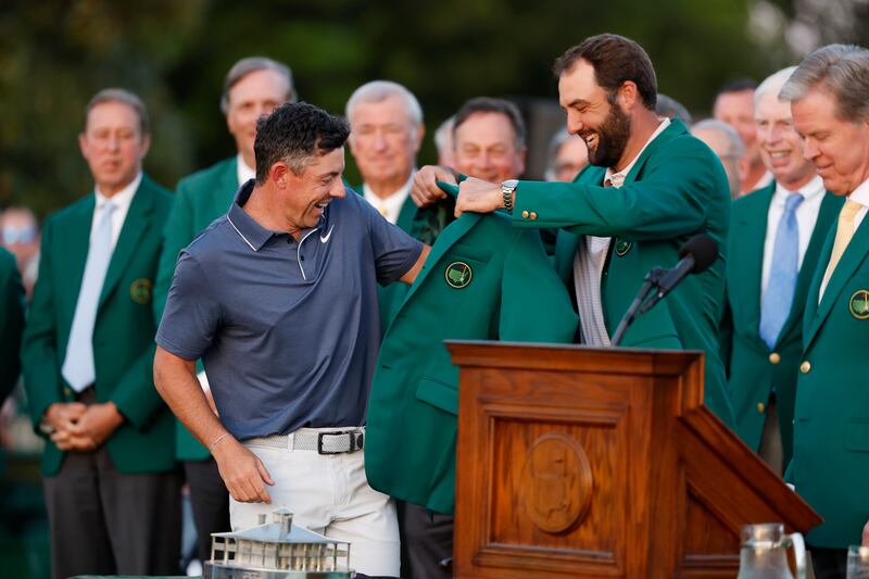 Scottie Scheffler (right) gives Rory McIlroy his green jacket after winning the 2025 Masters. Photograph: Harry How/Getty Images