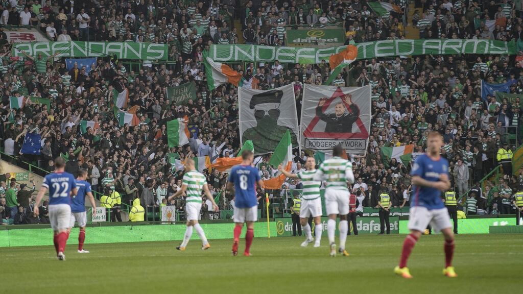 Celtic fans display banners during their Champions League qualifying clash with Linfield. Photo: Getty Images
