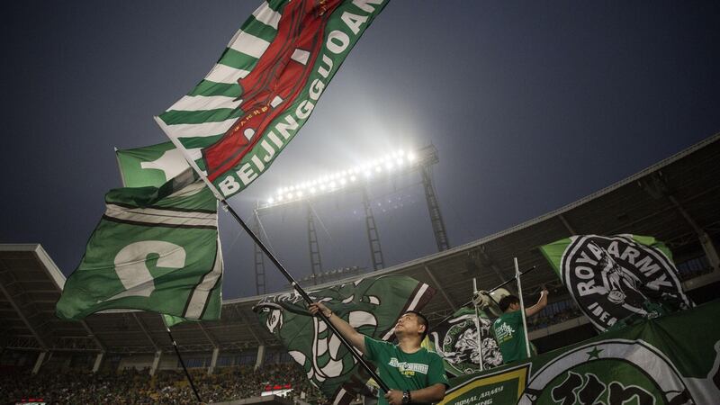 Ultra supporters of Beijing Guoan. Photograph: Kevin Frayer/Getty Images