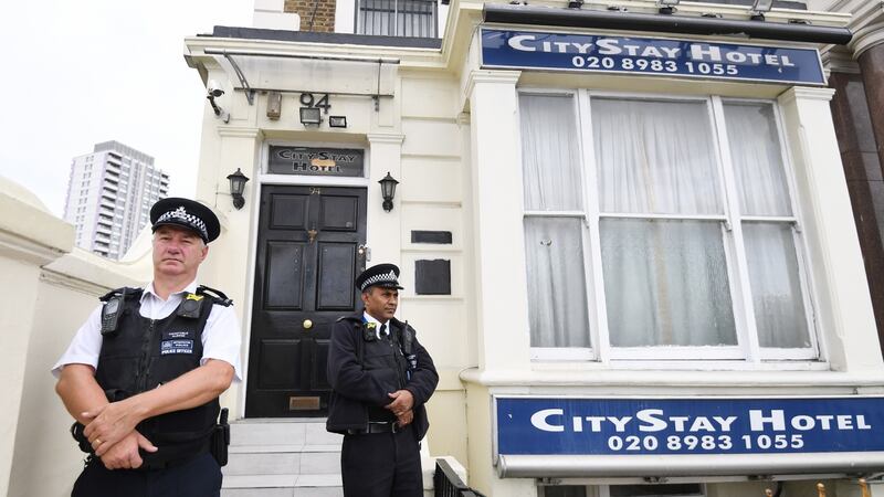 Police stand guard outiside the City Stay hotel in Bow, east London on Wednesday where Russians Alexander Petrov and Ruslan Boshirov stayed during the Salisbury poison attack and where traces of Novichok nerve agent where found in a room. Photograph: Facundo Arrizabalaga/EPA