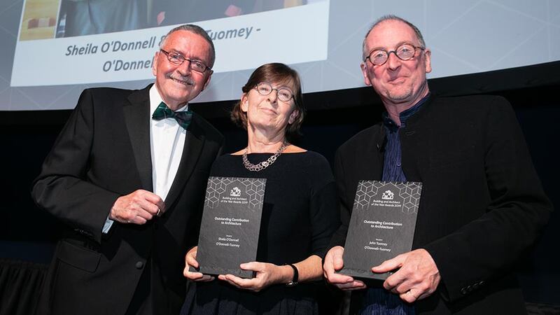 Frank McDonald, Awards Judging Co-ordinator presents the Outstanding Contribution to Architecture award to John Tuomey and Sheila O’Donnell - O’Donnell + Tuomey.