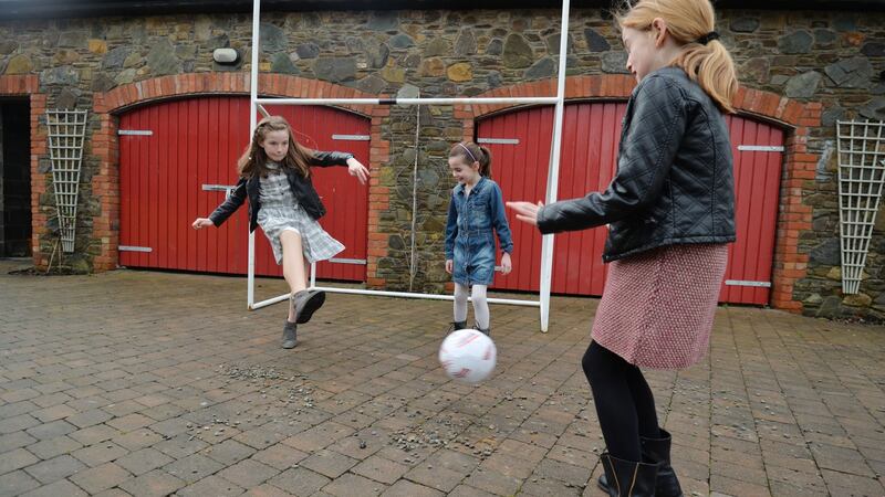 Amy Sheridan (11) who was born without a fibula, at home in Dunleer, Co Louth with her sisters Sally (7) and Lucy (9). Photograph: Alan Betson