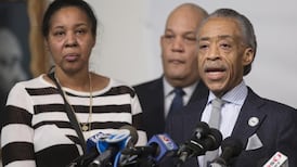 A divided city mourns deaths of two officers